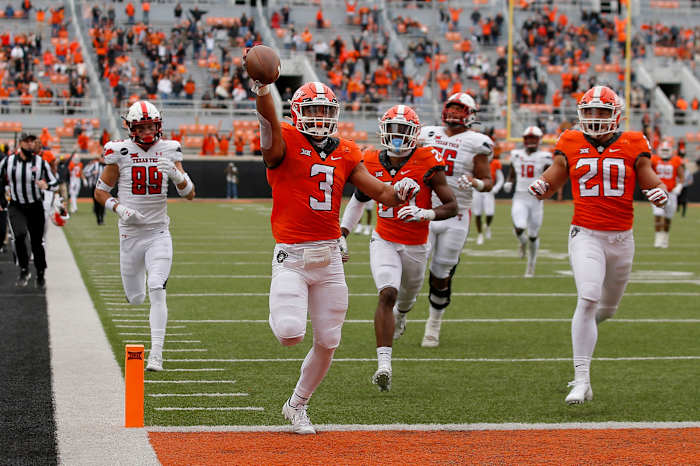 Oklahoma State safety Tre Sterling and his escort hit the end zone on a 65-yard pick six interception.